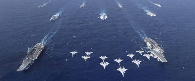 In October, the PLAN for the first time operated two carrier strike groups together in the South China Sea, the Liaoning and the Shandong CSGs. The carriers were accompanied by at least 11 escorts—destroyers, frigates, and replenishment ships—and included J-15 flight operations from each carrier. 