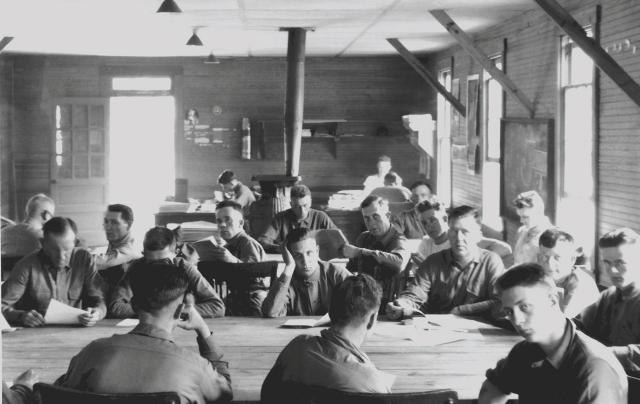 In 1919–20, as commanding general of Marine Barracks, Quantico, Virginia, Lejeune began an educational program based on correspondence courses to sharpen the minds and improve the lives of enlisted Marines. Once he became Commandant, the program was enlarged and named the Marine Corps Institute. Above: Institute student-Marines hit the books during a study hall at Quantico in 1920.