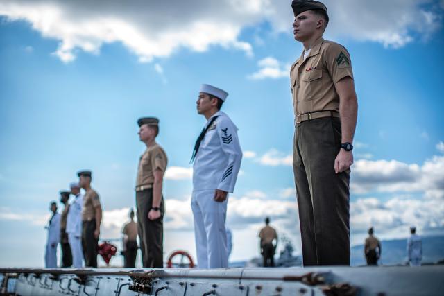 Marines from the 11th Marine Expeditionary Unit man the rails alongside sailors from the USS John P. Murtha (LPD-26) at Pearl Harbor. The Navy and Marine Corps have embraced the “one team, one fight” mantra and are working to develop doctrine to make sea control a shared concept.