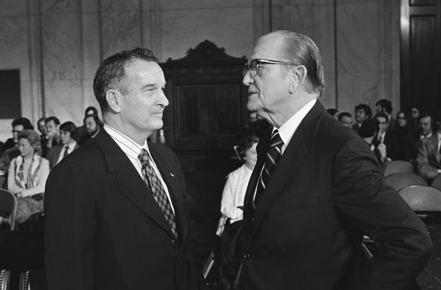 Defense Secretary–designate William P. Clements, left, talks with Senator John C. Stennis (D-MS), chairman of the Senate Armed Services Committee, in January 1973.