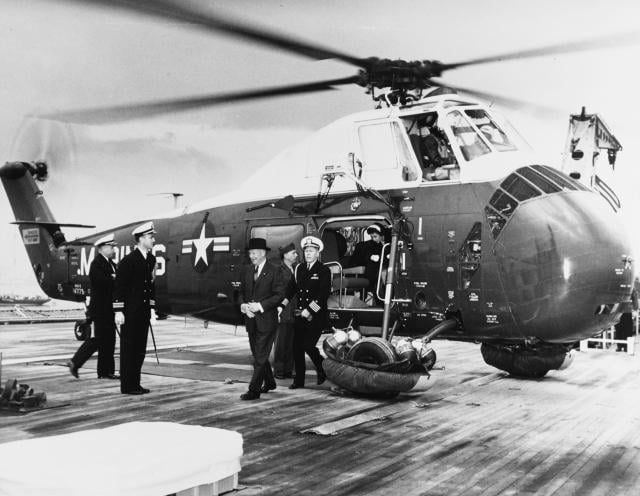President Dwight D. Eisenhower arrives on board the USS Des Moines (CA-134) in 1959. The Sikorsky HUS-1 had greater capacity than its  predecessor presidential helicopter but still lacked certain creature comforts.