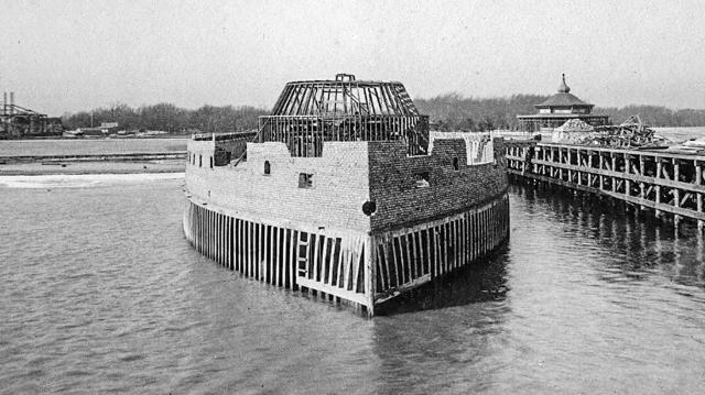 Progress on the construction of the naval display known as the “U.S.S. Illinois” on 16 December 1891 shows the brickwork on the upper hull and lathing on the lower to support steel plates. 