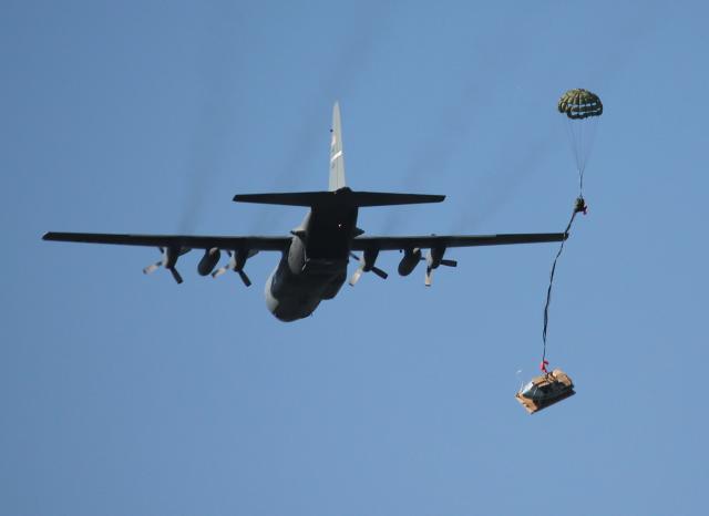 Small unmanned surface vehicles such as the Greenough Advanced Rescue Craft (GARC)—here, being dropped by a C-130—could extend surface combatants’ surface-search range and operational reach by several hundred miles.
