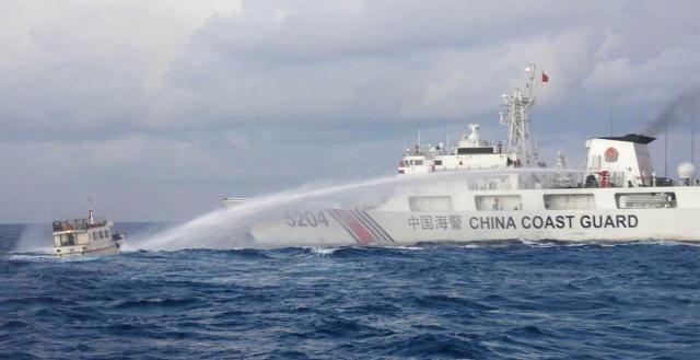 A China Coast Guard ship blasts a Philippine resupply vessel with a water cannon at Ayungin Shoal in December 2023. China’s increasing aggression in the South China Sea threatens both the United States and the Philippines, opening opportunities for renewed partnerships.