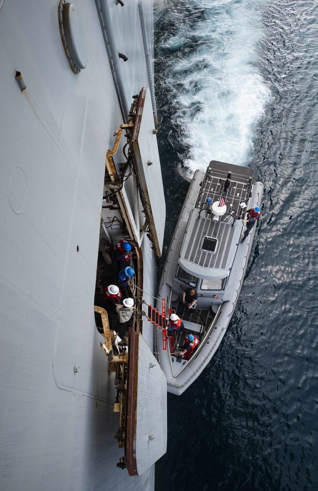 Sailors from the USS Bataan (LHD-5) operate a RHIB