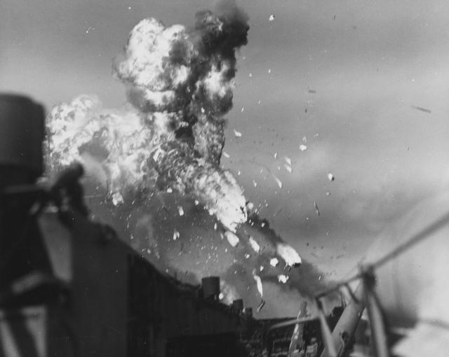 Knocked out of the sky: A kamikaze disintegrates after being hit by the antiaircraft batteries of the USS Intrepid (CV-11) in the Philippines, 25 November 1944.