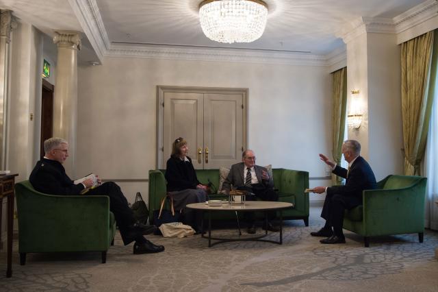 Rear Admiral Craig S. Faller, Valerie Gray, Colin Gray and Secretary of Defense James Matting talk strategy during Mattis’ trip to London in April 2017. 