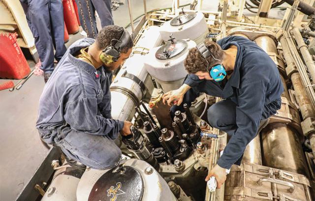 Enginemen conduct maintenance on board the dock landing ship USS Carter Hall (LSD-50). Navy leaders have to consider key decisions, such as when to share the workload among multiple departments, to meet evaluation dates and other deadlines.