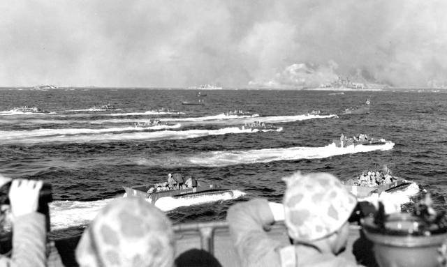 Tracked landing vehicles head toward Iwo Jima