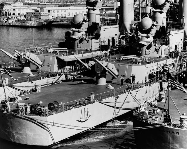 The USS King (DLG-10) tied up in San Diego between the Coontz (DLG-9) and Mahan (DLG-11) with Terrier missiles on their launching racks.