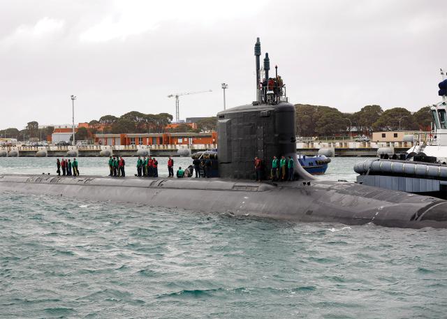Sailors assigned to the USS Hawaii (SSN-776) prepare to moor at HMAS Stirling, Western Australia, on 22 August 2024 to conduct a maintenance period together with a Virginia-class fast-attack submarine and test the ongoing exchanges between the two navies. AUKUS will ensure continued cooperation among the three allies and increase deterrence in the region.