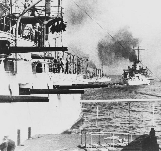 Battleships of the Great White Fleet in Sydney Harbor, Australia, in August 1908. In the foreground are the 6"/40 broadside guns of the USS Wisconsin (BB-9). The USS Ohio (BB-12) is at right, and the Missouri (BB-11) is in the center. U.S. Naval In-stitute Photo Archive.