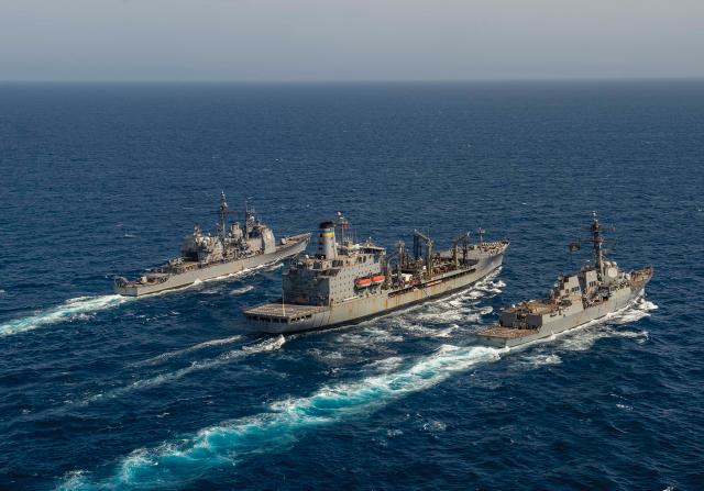 The wake size and screw churn of the USS San Jacinto (CG-56), the USNS Laramie (T-AO-203) and the USS James E. Williams (DDG-95), all moving at the same speed during an underway replenishment, demonstrate Galileo’s law: larger and longer ships move relatively easier through the water than smaller, shorter ones.