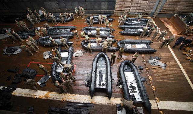 Marines from the 31st Marine Expeditionary Unit prepare small boats on the well deck of the dock landing ship USS Germantown (LSD-42). Force Design 2030 proposes changes to the Marine Corps that could result in more small boat operations and fewer amphibious assault and combat vehicles. But only operational testing of such ideas will show whether they will enable the Fleet Marine Force to win a great-power naval campaign.