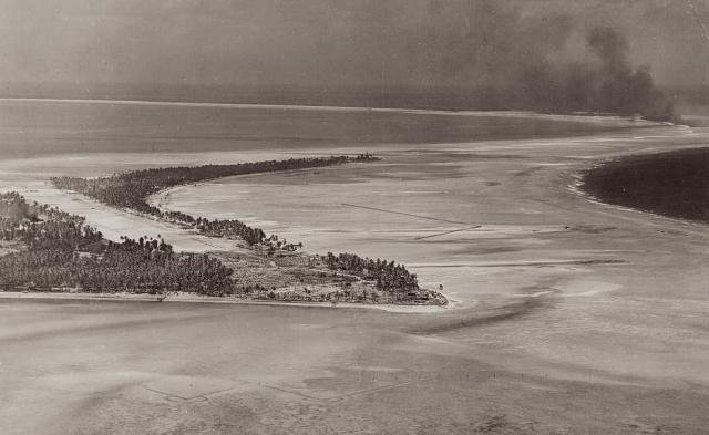 Tarawa Atoll, with Betio Island in the foreground, as seen by the planes from the USS Lexington, 18 September 1943. Nine weeks later, U.S. Marines would be hitting the island en masse—and would have advanced right into a horrific “Sea of Fire” had the September raid not thwarted the Japanese defenders in setting the deadly trap.