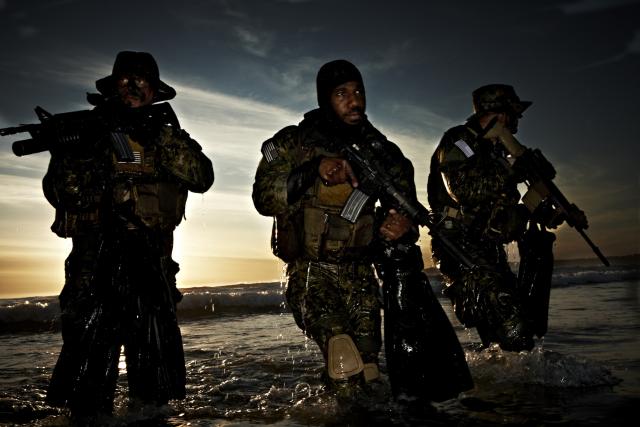  Navy SEALs training at night.