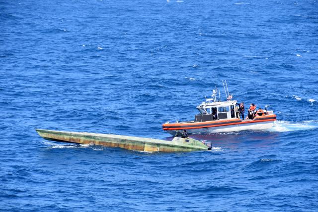 Coast Guard boarding team interdicts a low-profile go-fast boat carrying illegal narcotics.