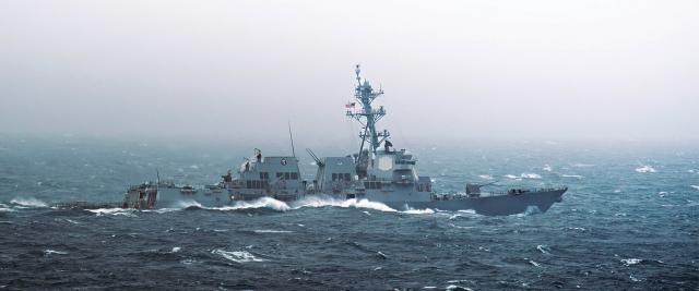 The guided-missile destroyer USS William P. Lawrence (DDG-110) sails in rough seas in the South China Sea in January. Transits of the South China Sea and other western Pacific areas provide direct-support cryptologists excellent opportunities to use their skills and exercise their SigInt authorities.