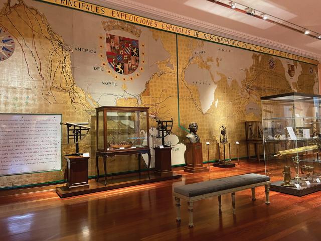 A gallery in the Museo Naval with a mural depicting Spanish voyages of discovery.