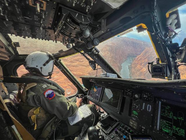 Lieutenant Claire Thatcher, an aviator from the Merlins of Helicopter Sea Combat Squadron 3, flies her MH-60S Seahawk/Knighthawk over the Grand Canyon in April 2024.