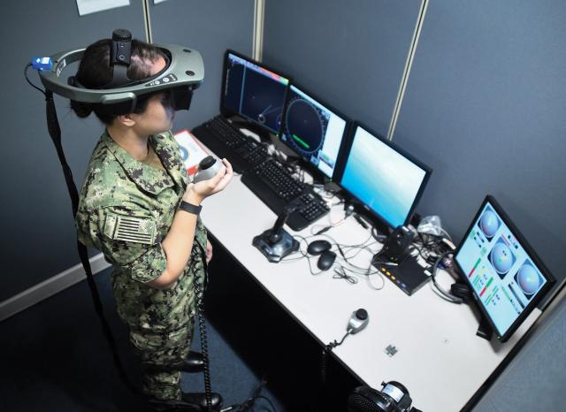 A surface warfare officer training with VR.