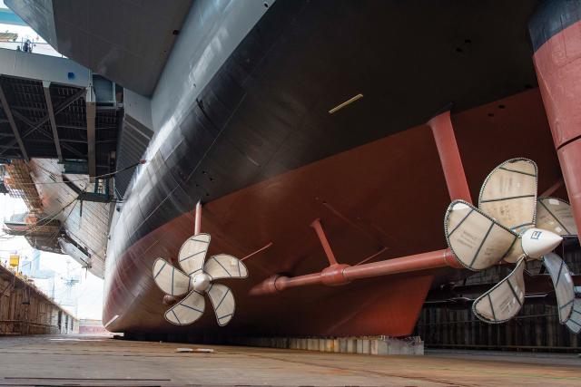 The propellers of the future John F. Kennedy (CVN-79) are seen in drydock shortly before she was first floated in October 2019. The ship was christened in December 2019.