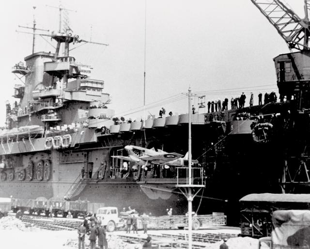 Spitfires are hoisted aboard the deck of the USS Wasp 