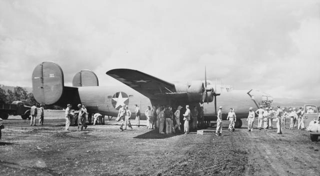 Marine ground crews and airmen service a PB4Y-1 Liberator 