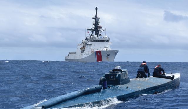 USCGC Munro (WMSL-755) crew members inspect a self-propelled semisubmersible in 2019, in international waters of the eastern Pacific Ocean. Dramatic scenes of successful narco sub interdictions positively impact the Coast Guard’s brand, but the service still must battle for every penny of every appropriation.