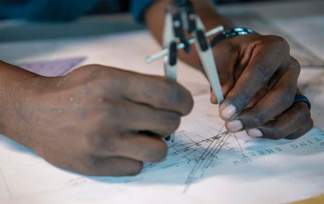 A quartermaster on board the Essex plots a course in the pilothouse. The Essex’s celestial navigation voyage gave the watch officers and quartermasters the opportunity to toil over a paper plot, watching their hand-drawn symbols move from west to east.