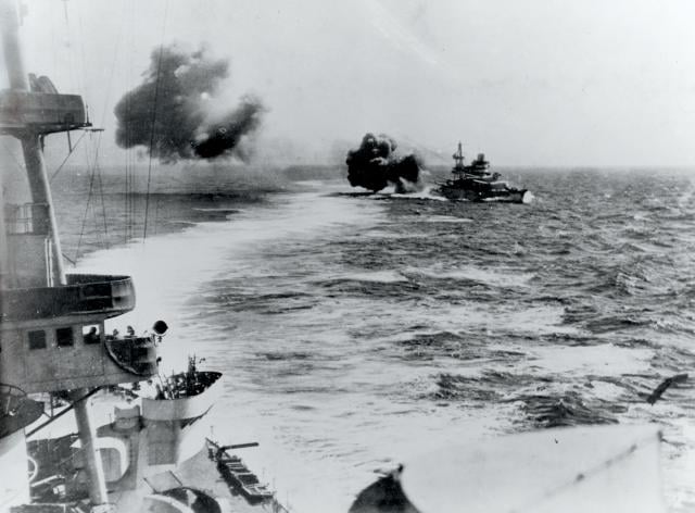 The July 1940 Battle of Calabria falls into the “decisive battle” category of World War II naval warfare. Above: The Italian battleship Conte de Cavour opens fire with her 320-mm main battery.