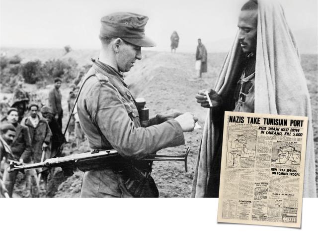 A German soldier gives a cigarette to a Tunisian
