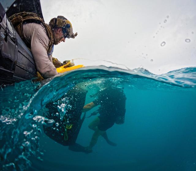 Submerge Ivan Skvaril  Sailors assigned to Explosive Ordnance Disposal Mobile Unit 5 conduct a body recovery exercise on Naval Base Guam, March 2023.