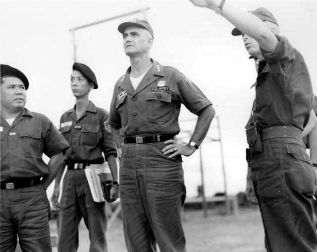 Lieutenant General William Westmoreland standing with ARVN advisors and staff.