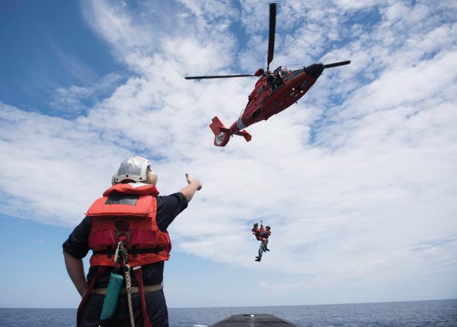 aken on the USS Alaska (SSBN-732) (BLUE) Patrol 100 during a training exercise, the Coast Guard Air Station Savannah “Lowcountry Lifesavers” return a sailor to Submarine Base, Kings Bay.