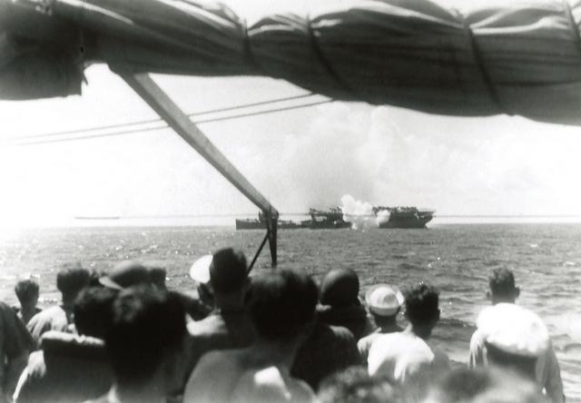 Viewed from the deck of the USS Whipple (DD-217), the Langley is torpedoed following fatal bomb damage south of Java,
