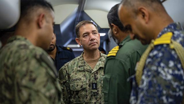 In 2023, then-Commander U.S. Fifth Fleet Vice Admiral Brad Cooper spoke with crew members assigned to Indian Naval Air Squadron 316 aboard an Indian Navy P-8I maritime patrol aircraft in Muharraq, Bahrain.