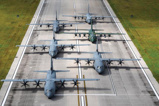 Three U.S. Air Force C-130J Super Hercules aircraft participate in an elephant walk alongside a Royal Canadian Air Force C-130J, a Japan Air Self-Defense Force C-130H Hercules, and a Republic of Korea Air Force C-130H at Andersen Air Force Base, Guam. Applying lessons from Ukraine could prevent an attack on Guam from becoming the next Pearl Harbor.