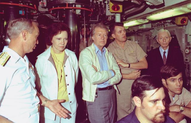 First Lady Rosalynn Carter, President Carter, and Admiral Rickover on board the submarine USS Los Angeles for a sea trial. Rickover remarked to reporters that day that “any sailor or officer in the Navy can become President.”