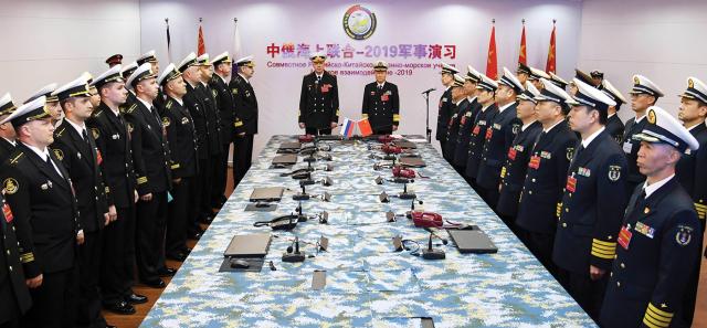 Chinese and Russian naval officers formally open a joint naval exercise in Qingdao, Shandong Province, China. A combined Chinese-Russian fleet would be smaller by tonnage than the U.S. Navy’s, but it would have far more hulls, some of which (such as Russian submarines) are quite capable.