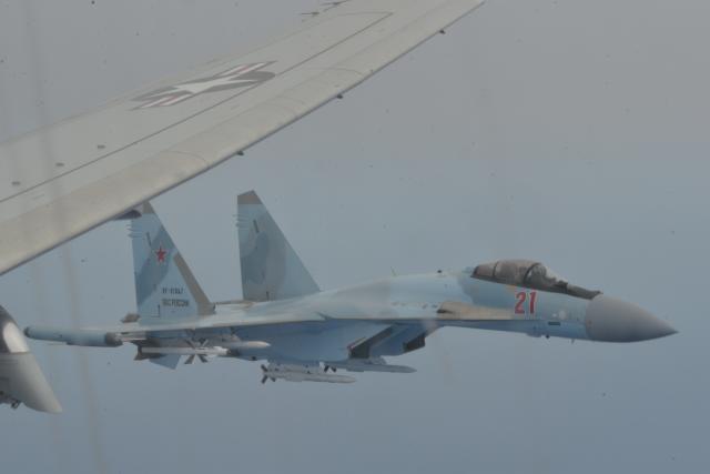 A Russian Su-35 intercepts a U.S. Navy P-8 Poseidon aircraft