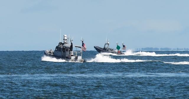 Swarms of unmanned boats, such as these unmanned  rigid-hull inflatable boats, could be deployed and, acting  cooperatively, simulate the signature of a larger platform  to confuse adversaries.