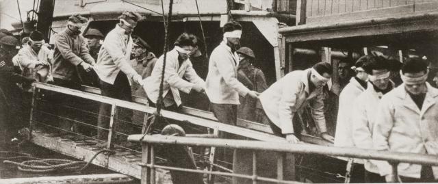 A group of the Scharnhorst’s 36 survivors gingerly make their way from the battleship HMS Duke of Wales, which fired the long-range shot that sealed the German battle cruiser’s fate. Rear Admiral Bey went down with the ship.