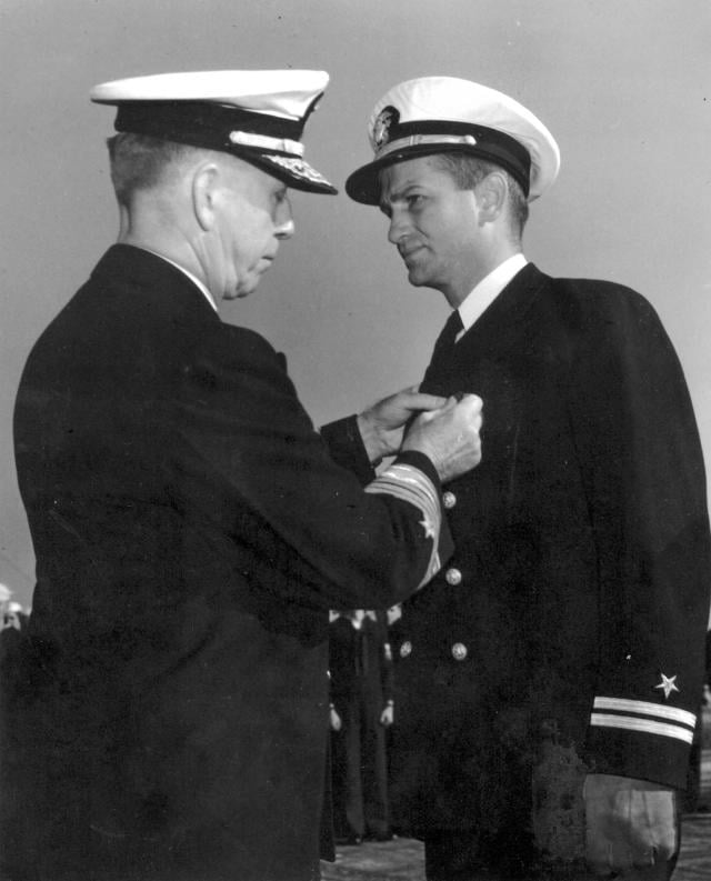 Lieut. Charles Hutchins receiving Navy Cross from Admiral Royal Ingersoll.