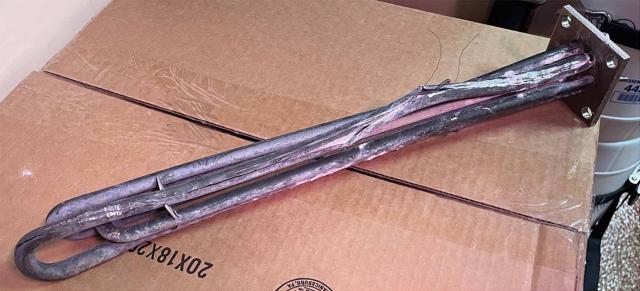 The grounded dishwasher heater from the USCGC William Chadwick (WPC-1150).  Note the filament wires sticking out. Many weeks were spent tracing the problem, but when students used energy scorekeeping, they identified the source of the problem in about five minutes.