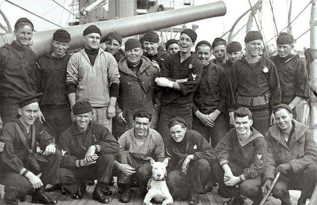 Dogs have long been part of the maritime world. Above, crew of the USS Sacramento (PG-19) and their canine, circa 1919.