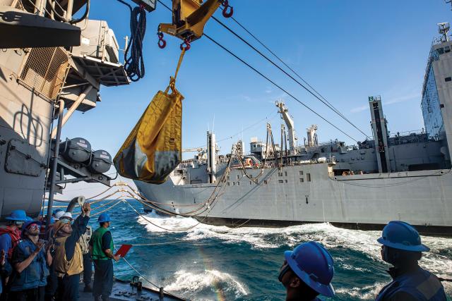The USNS Alan Bartlett Shepard (T-AKE-3) conducts replenishment at sea with the guided-missile cruiser USS Philippine Sea (CG-58). Logistics ships allow the carrier strike group to remain on station longer, keeping it in the fight and at peak readiness.