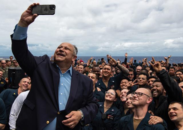 Secretary Del Toro captures a photo with the sailors of the USS Essex (LHD-2)