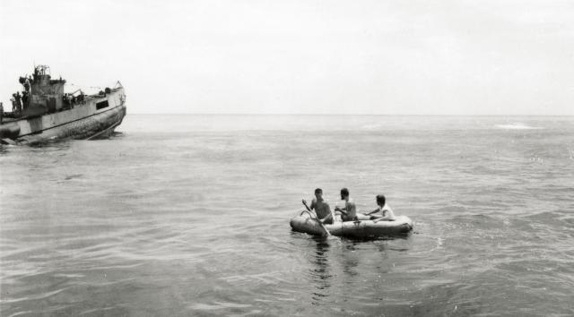 Crewmen shuttled between the two submarines hooking up tow lines, hoping to pull the O-19 free.