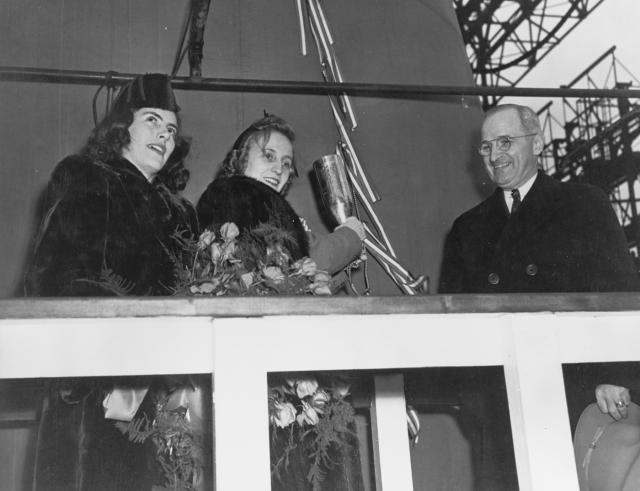 New York Navy Yard, 29 January 1944: (L. to r.) Maid of Honor Jane Lingo; Margaret Truman, sponsor; and Senator Harry S. Truman of Missouri are on the platform just prior to the launching of the battleship Missouri. Senator Truman was destined for bigger things—as was the ship.